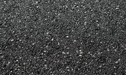 Blacktop texture. Asphalt road blacktop background. Rough road black surface. Black texture of wet asphalt on the road.