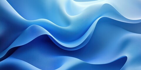 Flowing blue fabric gracefully undulates in soft waves under gentle light in an abstract textile display