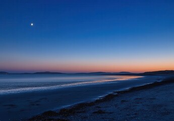 Fototapeta premium Serene Coastal Twilight Scene with Calming Blue Hues and Moonlight Reflecting Over Peaceful Ocean Waves and Starlit Horizon at Dusk