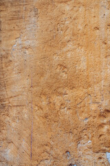 Terracotta colored plaster wall, rustic background or texture