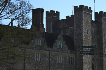 sign post with knole house and gatehouse as a background