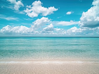 Fototapeta premium Serene Tropical Beach with Crystal Clear Water and Dramatic Cloudy Sky, Ideal for Travel and Nature Themes, Perfect for Relaxation and Escape Imagery