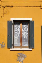 Typical renaissance window in Burano, Italy