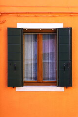 Typical renaissance window in Burano, Italy