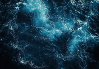 Stunning Aerial View of Deep Ocean Waves with Dynamic Patterns and Bright Turquoise Reflection Under Sunlight