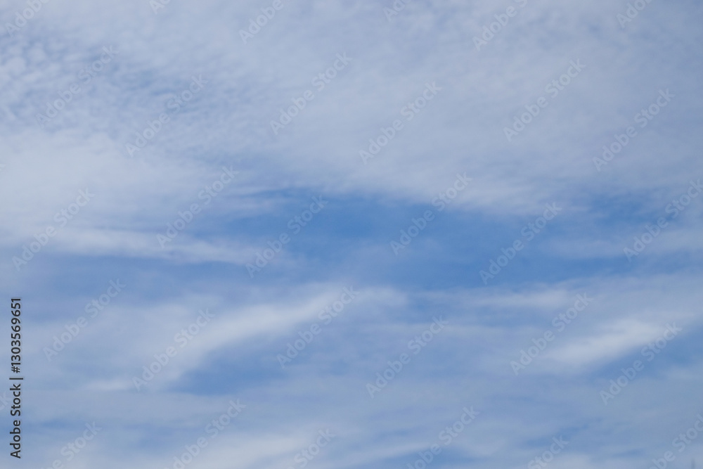 Poster soft blue sky and white clouds texture background.patterns and shapes of white clouds during the day
