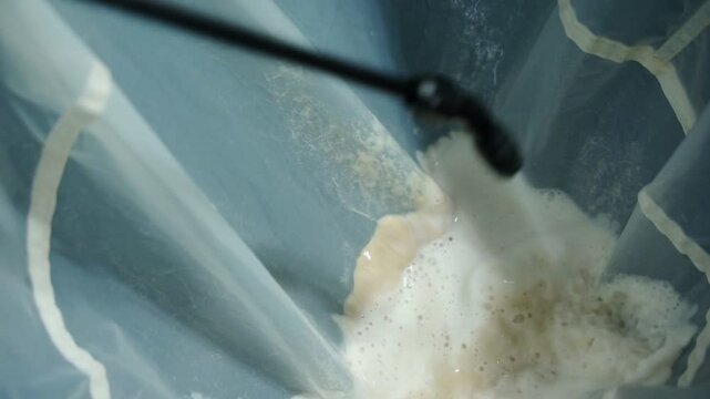 Hash Being Rinsed Off The Walls of A Filter Bag