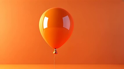 A vibrant orange balloon against a matching background, evoking a playful atmosphere.