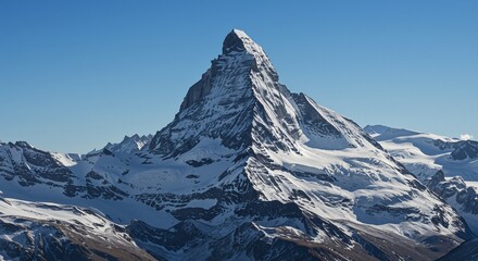 Majestic snow-capped mountain peak towering against a clear blue sky conveys a sense of tranquility and awe, representing nature's grandeur in a serene alpine landscape