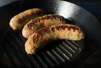 Cooking process: panfry pork sausage on a cast iron pan