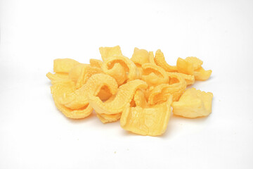 Close up of traditional yellow crackers isolated on white background.Traditional food concept.Typical Indonesian crackers.For graphic design or banner background
