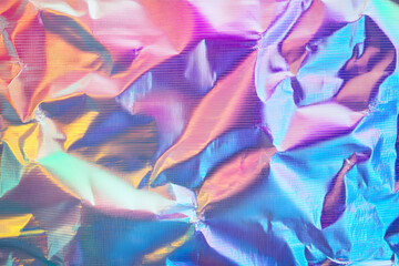 Holographic rainbow wrinkled foil iridescent texture abstract hologram background