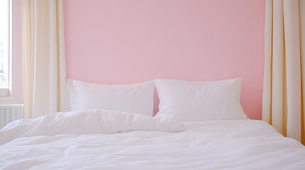 Obraz premium Serene Bedroom Setting: A cozy bed with white linens and pillows against a soft pink wall. A peaceful and inviting atmosphere.
