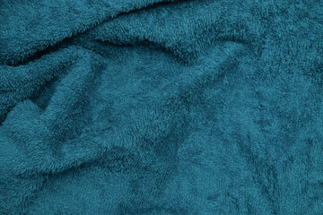 Wavy and wrinkled texture background of blue towel fabric. Smooth and soft towel fabric. For graphic design, 3D rendering or banner background