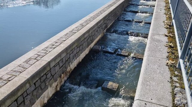 turbid water during the flood falls from large dams and forms a lot of foam. fish pass is a neutrality for overcoming the height differences of hydroelectric power plants and weirs for fish.