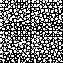 Seamless pattern of bright white polka dots on a black background. Vector eps10