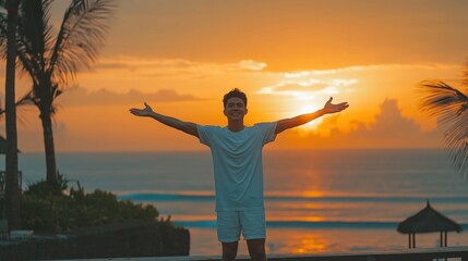 Fototapeta premium Sunset Serenity: A Man Embraces the Golden Hour on Tropical Beach
