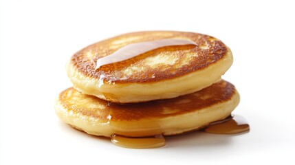 Stacked pancakes dripping with syrup. Food background