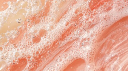 Obraz premium Pink liquid swirling, bubbles floating. Abstract foam texture background in water with peach hues