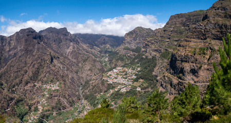 View from the Eira do Cerrado viewpoint towards the town of Curral das Freiras, in the central mountain range of Madeira.

