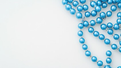 Fototapeta premium Blue Beaded Necklace on White