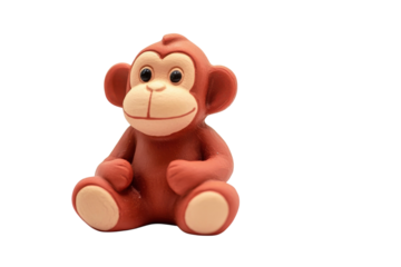 A charming little monkey figurine sitting on a plain background, full of personality and playfulness isolated on transparent background