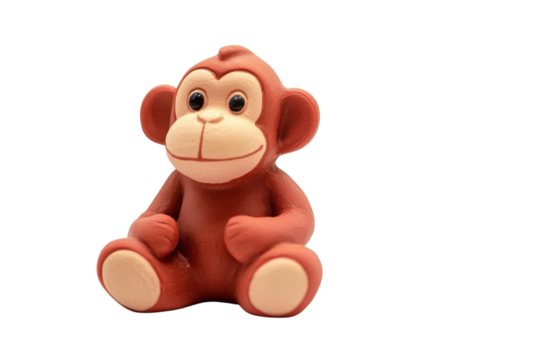 A charming little monkey figurine sitting on a plain background, full of personality and playfulness isolated on transparent background