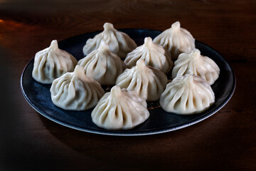 A plate of khinkali, the traditional dumplings of the Caucasus, showcasing the region’s rich culinary heritage