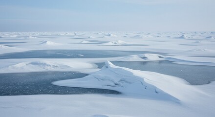 Obraz premium Arctic Ice Landscape with Snowdrifts and Open Water Under Bright Sky