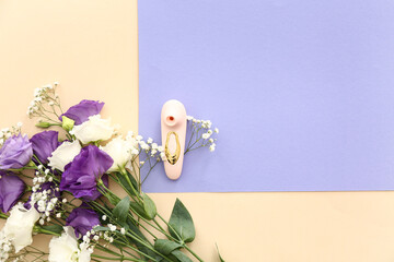 Beautiful eustoma with gypsophila flowers and vibrator on color background
