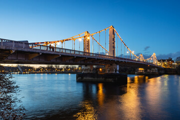 Fototapeta premium Chelsea Bridge over the River Thames in west London, take at dusk.