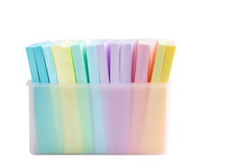 A colorful array of pastel sticky notes arranged neatly in a clear container on a soft surface isolated on transparent background