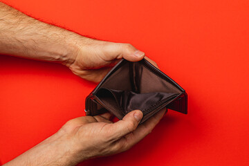 Empty wallet reflects financial struggles and the impact of economic crisis