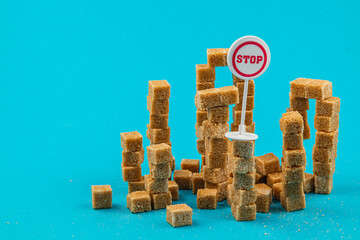 Sugar cubes create a whimsical cityscape with a stop sign in vibrant colors