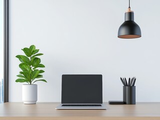 Modern minimalist workspace featuring a laptop, plant, and stylish lighting