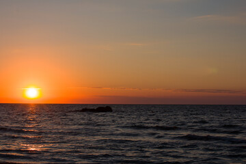 landscape clouds over the sea. Bright red sunset