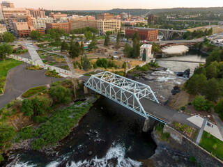 Naklejka premium Aerial view of Spokane, Washington, showcasing the city skyline, the Spokane River. The photo highlights the city's blend of urban and natural landscapes. Riverfront Park, USA
