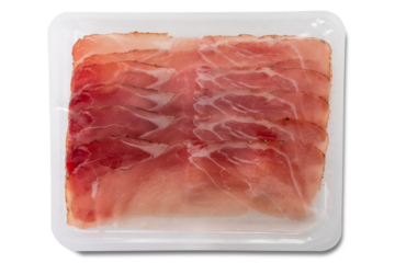 Slices of speck ham packaged in plastic tray isolated. Typical smoked ham from South Tyrol, Italy