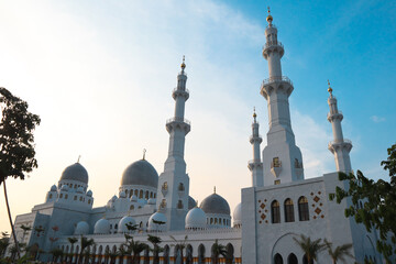 Grand Mosque Exterior White Domes Against Azure Sky,Surakarta, Central Java, Indonesia