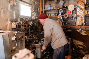 Elderly Craftsman Working in a Rustic Workshop
