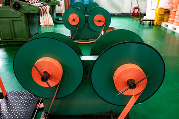 The weaving workshop machinery of a certain packaging factory is running, producing new fiber ropes and fiber bags