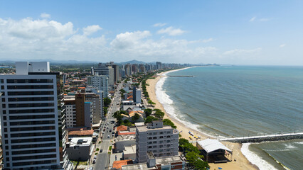 Panoramic aerial photograph of the city of Balneário Piçarras, located on the coastline of Santa Catarina, Brazil, highlighting its beaches, cityscape, and ocean views.