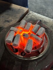 Fire burning from coconut charcoal briquette for business production	
