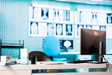 Professional healthcare office with diagnostic tools and a pc display, showcasing a designated...