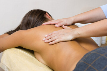 Skilled Therapist Performing Relaxing Back Massage in Tranquil Spa Setting
