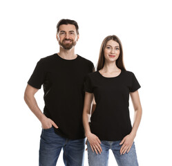 Fototapeta premium Woman and man wearing blank black t-shirts on white background. Mockup for design