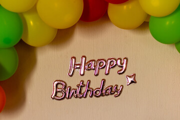 happy birthday sign with colorful balloons