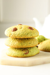 Delicious mint chocolate chip cookies on white table, closeup