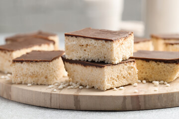 Delicious puffed rice bars on gray table, closeup