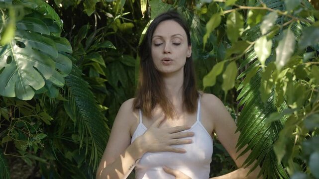 Woman practicing breath technique,Inhale slowly exhale slowly